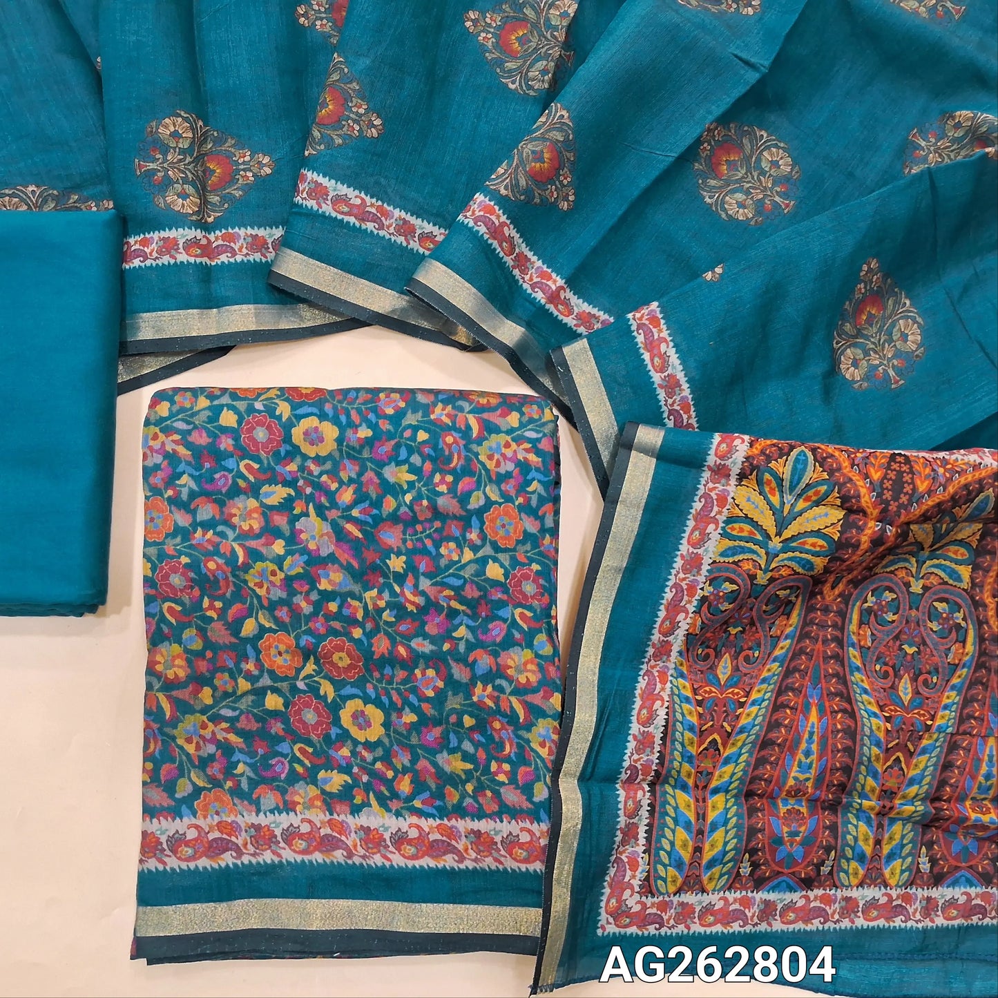 Teal Blue floral printed soft silk cotton unstitched salwar material, tissue borders on daman (Lining Needed) Matching spun cotton bottom, digital printed soft silk cotton dupatta with borders. AG262804