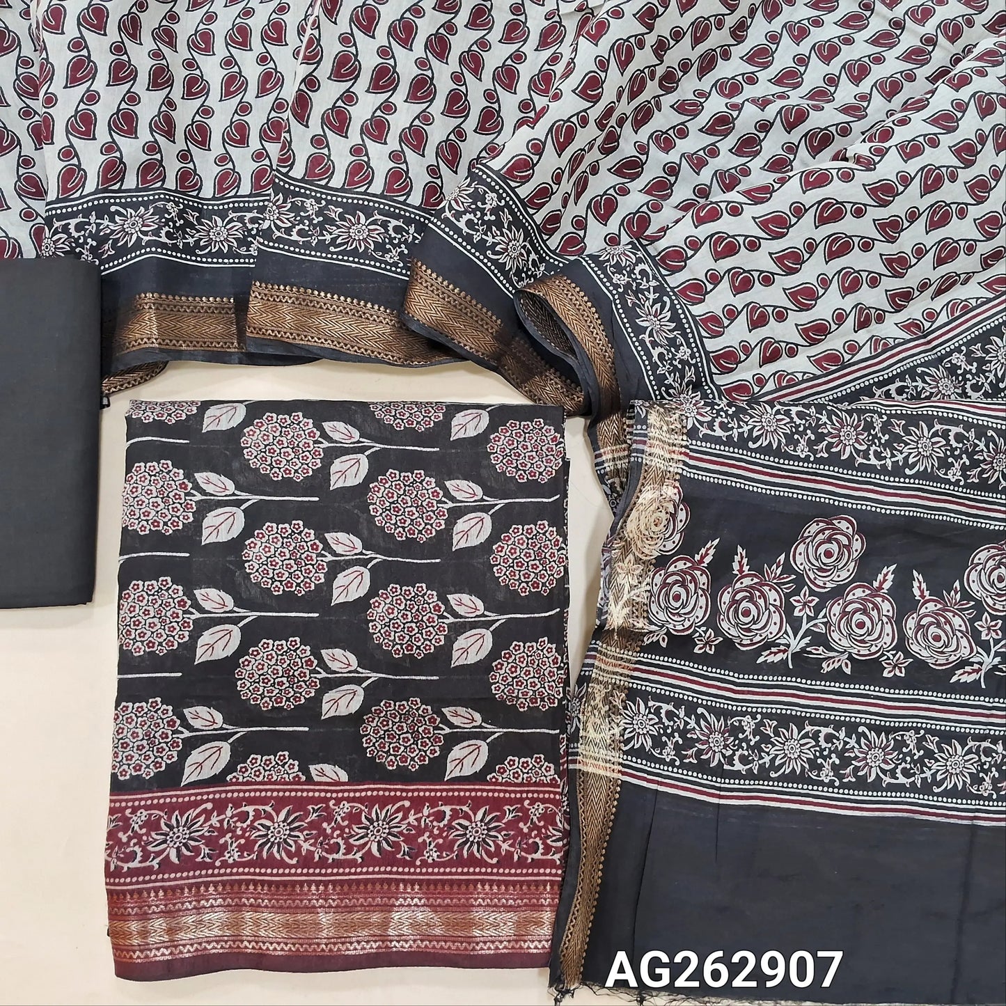 Black soft silk cotton unstitched salwar material, digital printed all over with zari woven daman border (Thin, Lining Needed) Matching cotton bottom, digital printed soft silk cotton dupatta. AG262907