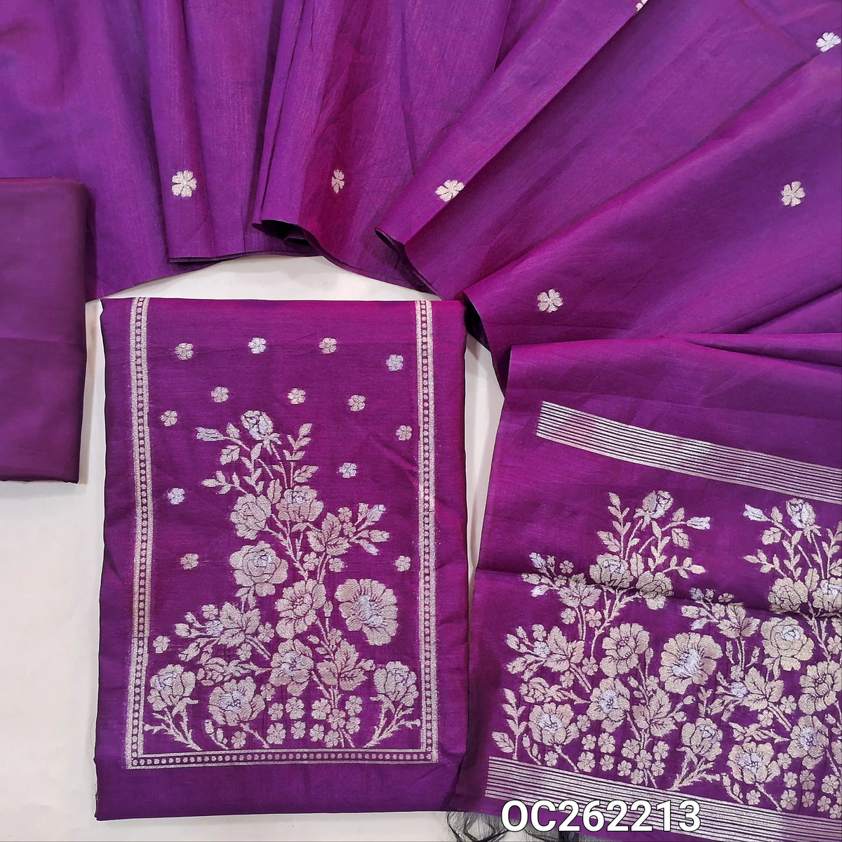 Purple premium silk cotton unstitched salwar material, buttas on front,antic gold and silver zari on yoke,(lining needed)silky bottom,buttas on full length silk cotton dupatta with rich pallu. OC262213