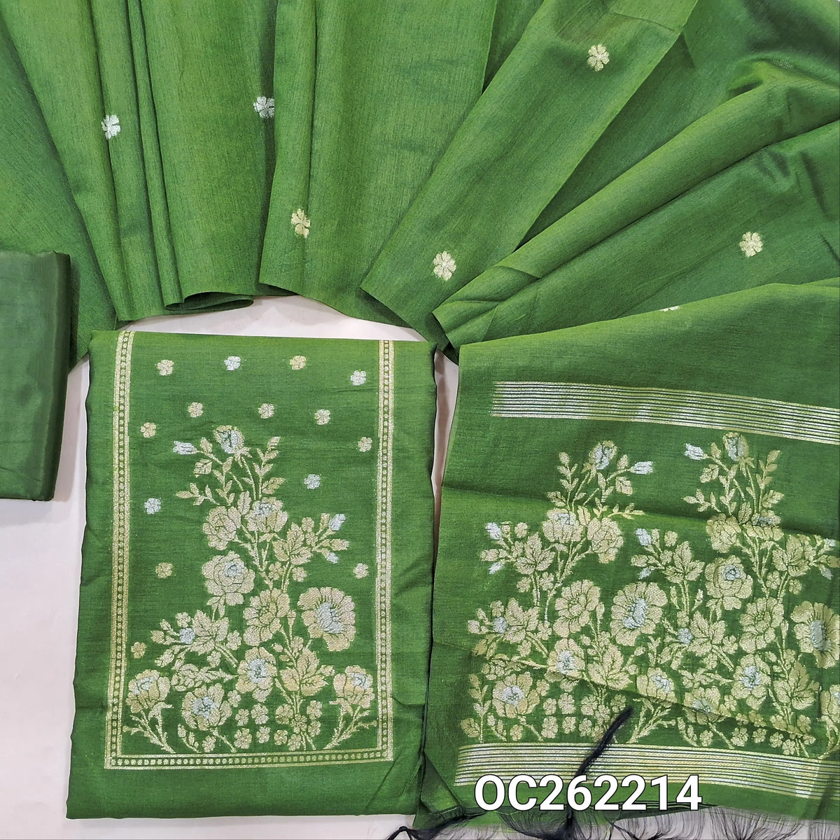 Leafy green premium silk cotton unstitched salwar material, buttas on front,antic gold and silver zari on yoke,(lining needed)silky bottom,buttas on full length silk cotton dupatta with rich pallu. OC262214