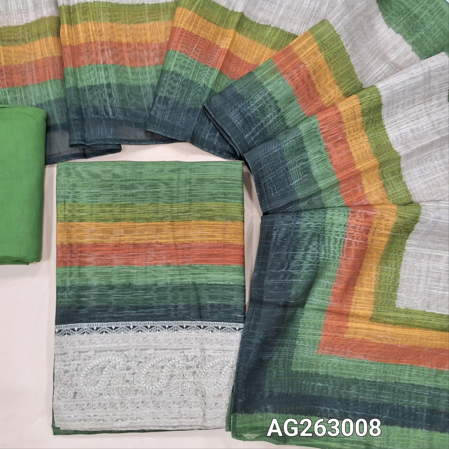 Leafy Green base multicolored slub silk cotton unstitched salwar material, embroidery on daman (Lightweight, Textured, Lining Needed) spun cotton bottom, multicolored spun silk cotton dupatta. AG263007