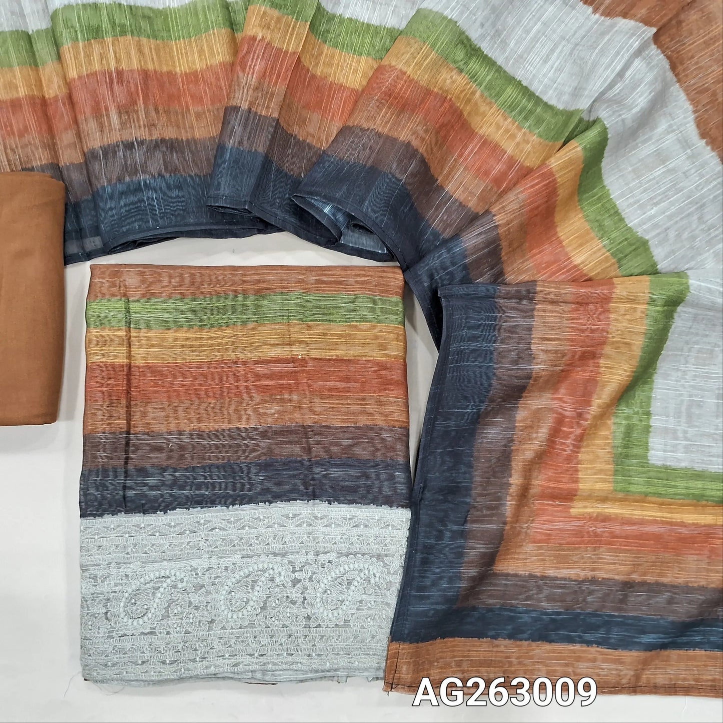 Light Brown base multicolored slub silk cotton unstitched salwar material, embroidery on daman (Lightweight, Textured, Lining Needed) spun cotton bottom, multicolored spun silk cotton dupatta. AG263008