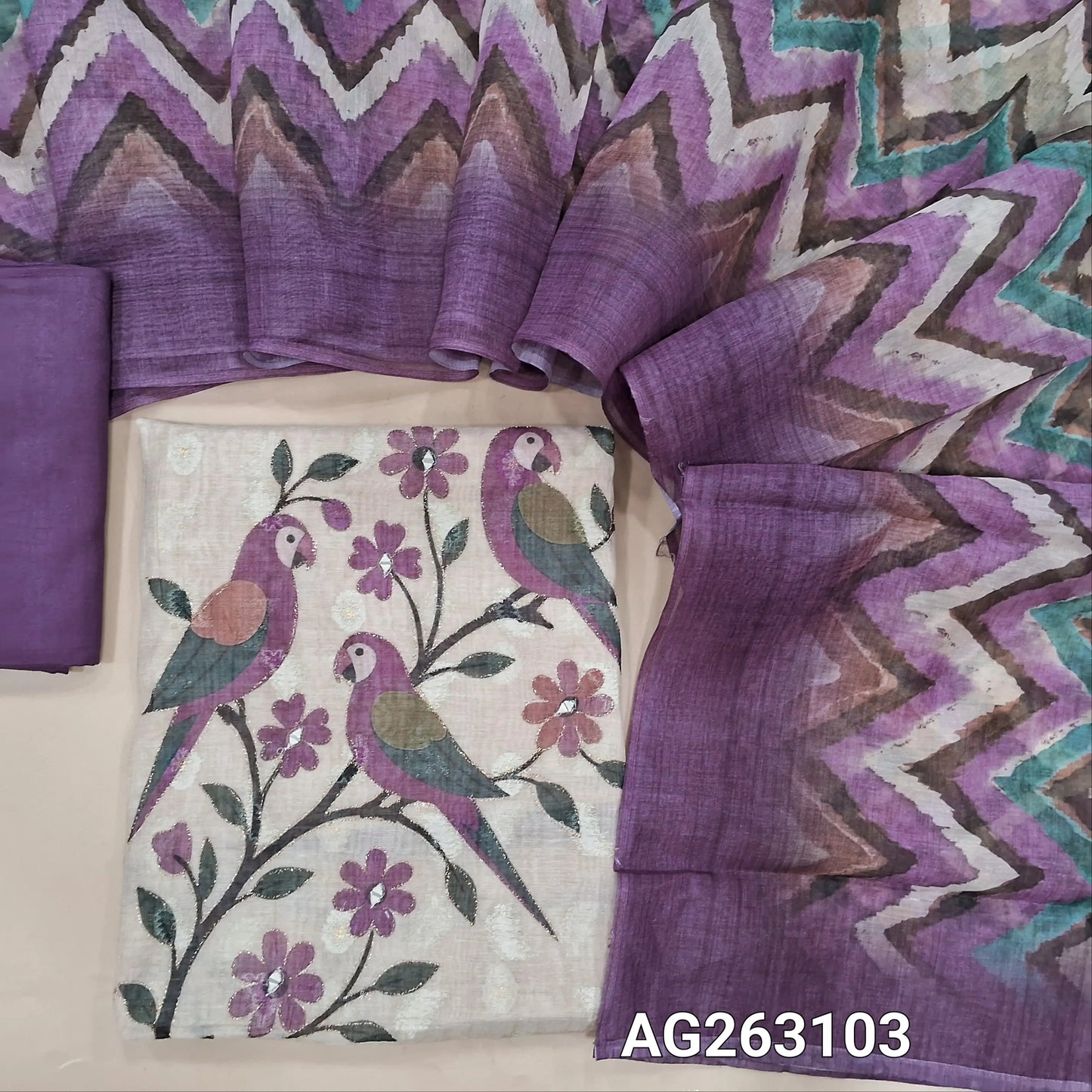 Beige and purple digital printed lightweight silk cotton unstitched salwar material, thread and silver zari woven buttas all over (Thin, Lining Needed) Matching santoon bottom, multicolored digital printed silk cotton dupatta. AG263103