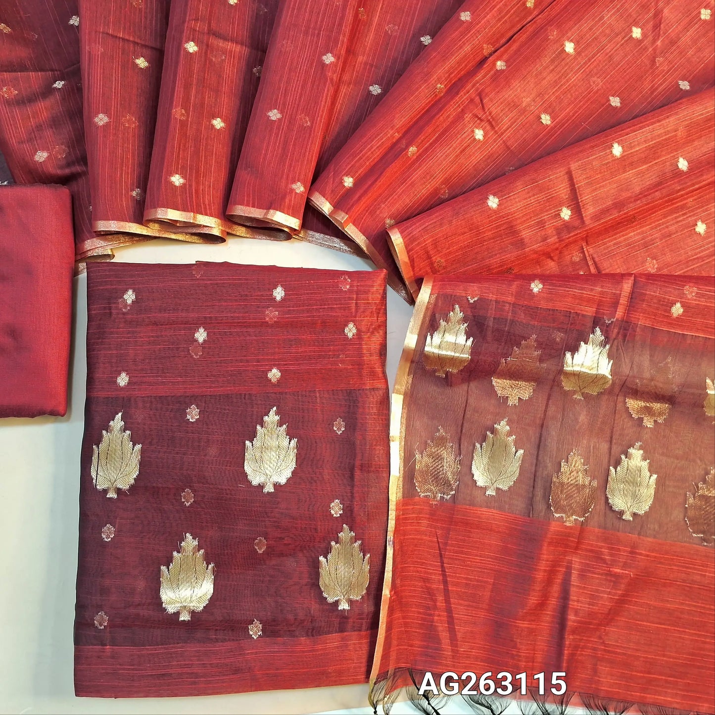 Reddish Maroon slub silk cotton unstitched salwar material, organza patch on daman, benarasi zari weaving all over (Lining Needed) Matching bottom, slub silk cotton dupatta with benarasi zari weaving. AG263115