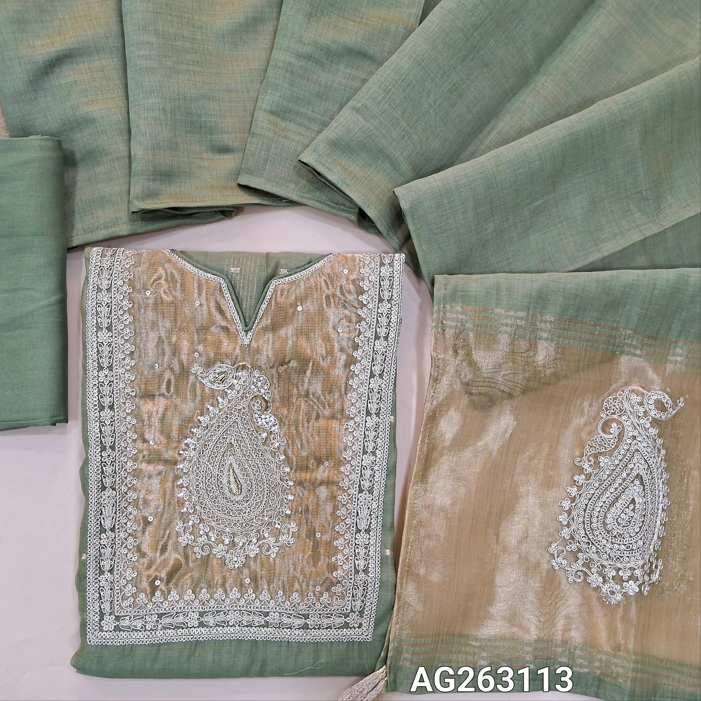 Sage Green designer premium silk cotton unstitched salwar material, rich tissue yoke with embroidery and zari detailing, zari woven buttas all over, tissue daman (Lining Needed) Matching Bottom, Silk Cotton dupatta with rich pallu. AG263113