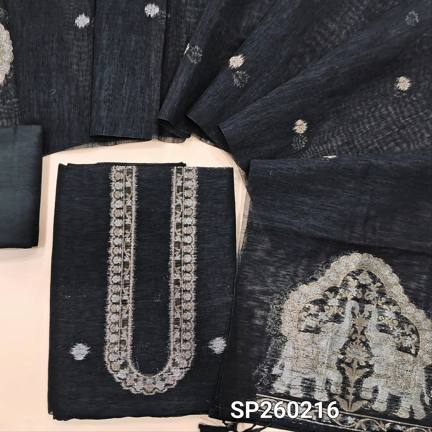 Black tussar unstitched salwar material with rich gold and silver jamdani weaving on yoke and daman (Thin, Lining Needed) Matching  santoon Bottom, jamdani woven tussar dupatta with handmade tassels. SP260216
