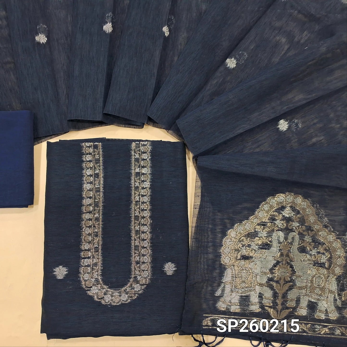Navy Blue tussar unstitched salwar material with rich gold and silver jamdani weaving on yoke and daman (Thin, Lining Needed) Matching  santoon Bottom, jamdani woven tussar dupatta with handmade tassels. SP260215