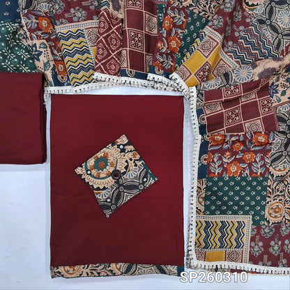 Maroon designer dabu cotton unstitched salwar material, applique and mirror work on yoke and daman (Lining Optional) matching bottom, printed mul cotton dupatta, printed dabu cotton over coat. SP260310
