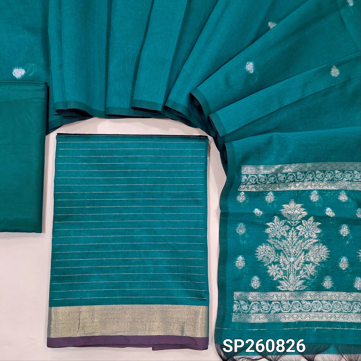 Teal blue silk cotton unstitched salwar material,zari lines all over,(Lining Needed)silky bottom, benarsi zari woven on full length silk cotton dupatta with rich gold and silver zari pallu. SP260826