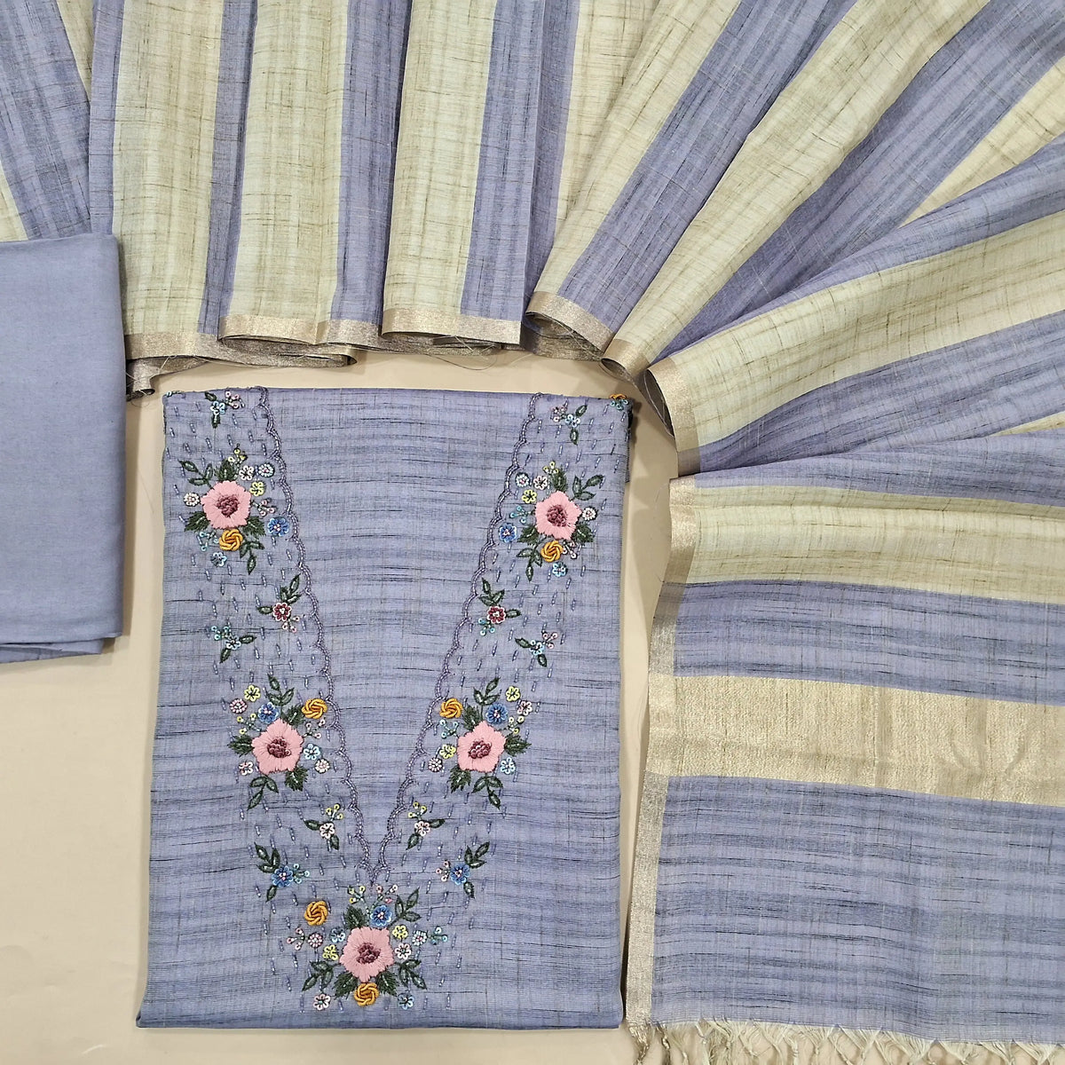 Designer lavender premium tussar unstitched salwar material, V neckline with hand embroidery and sequins work (Textured, Lining Needed)macthing santoon bottom, striped tussar dupatta. SP260818