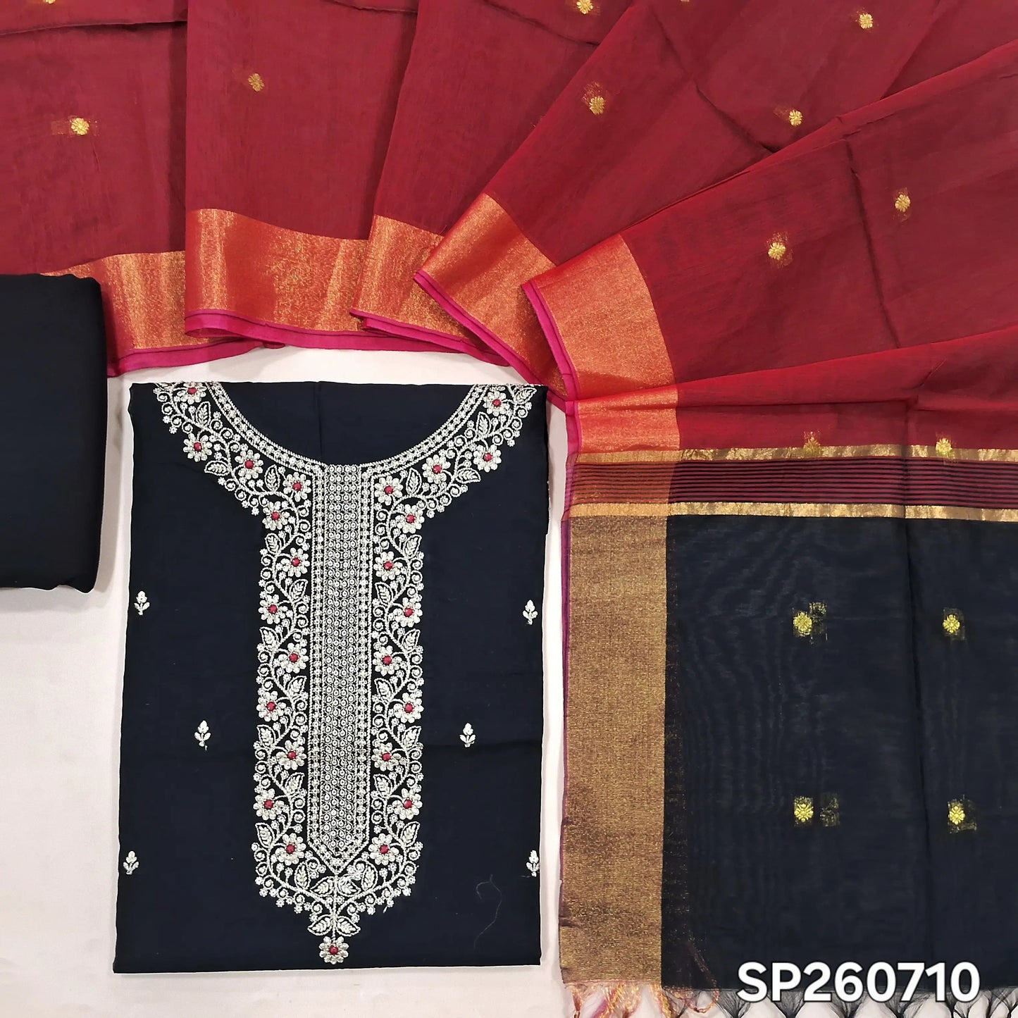 Black and reddish maroon silk cotton unstitched salwar material, zari and sequins detailing on yoke and front (Thun, Lining Needed)matching spun cotton bottom, silk cotton dupatta with small zari buttas and contrast pallu. SP260710