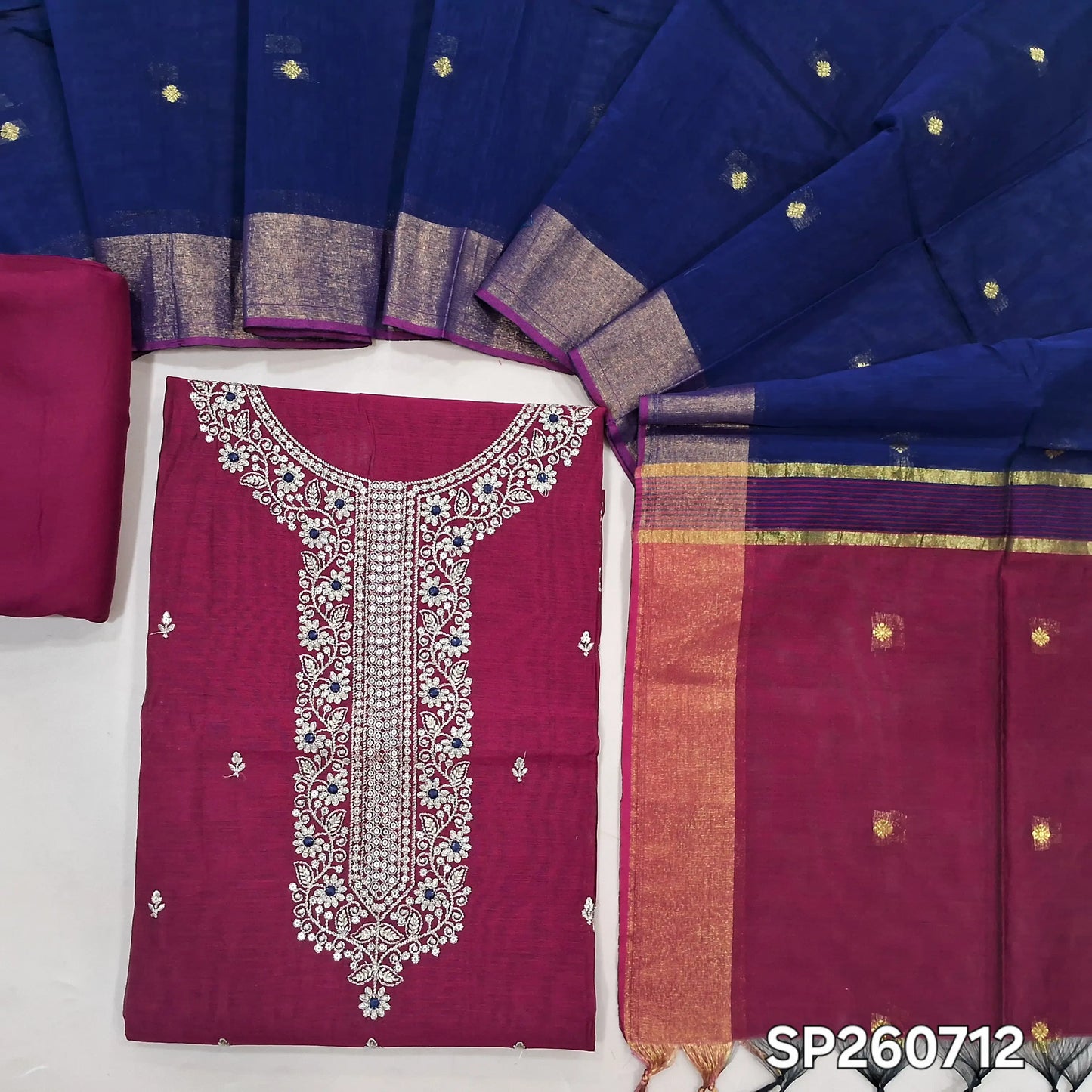 Rani pink and blue silk cotton unstitched salwar material, zari and sequins detailing on yoke and front (Thun, Lining Needed)matching spun cotton bottom, silk cotton dupatta with small zari buttas and contrast pallu. SP260712
