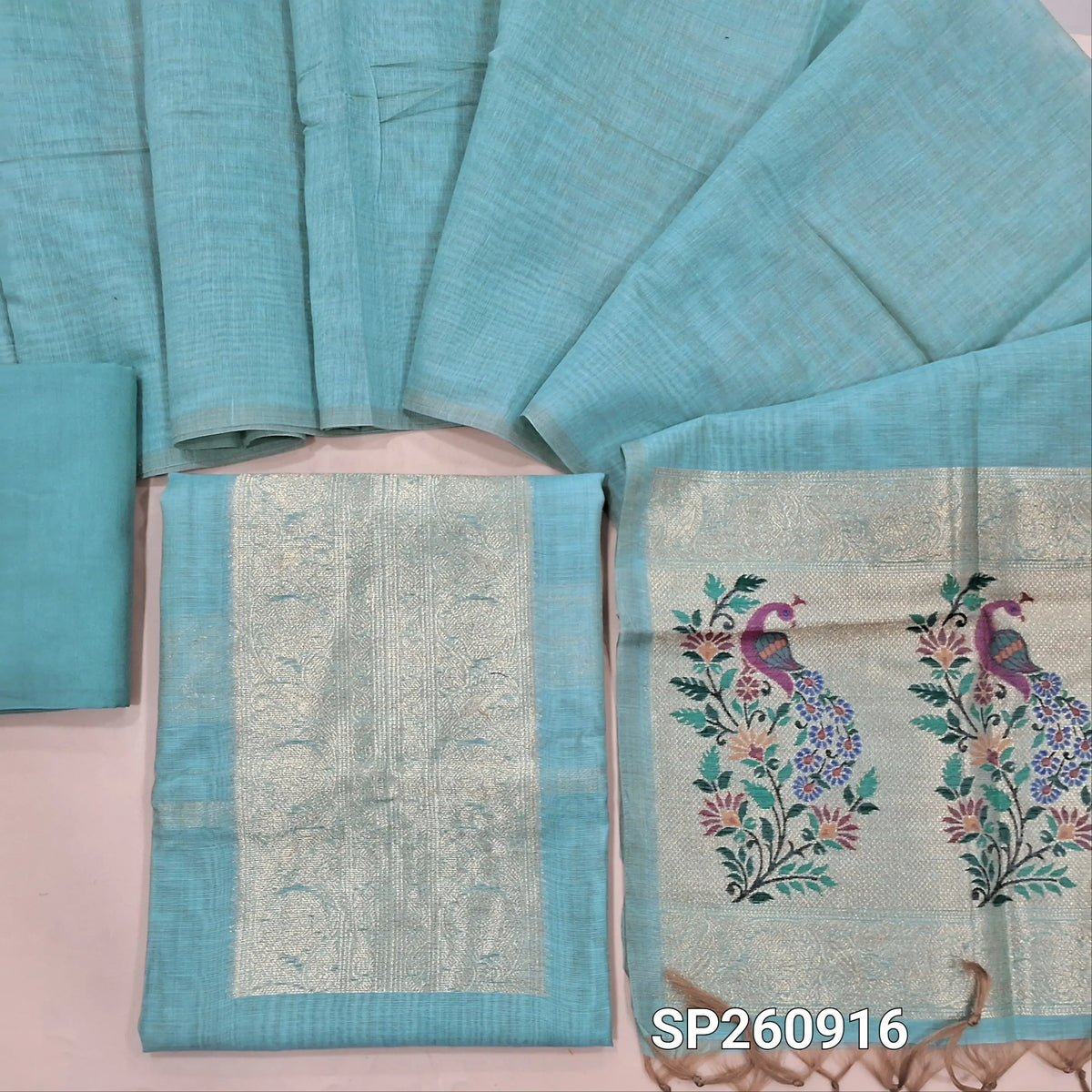 Pastel blue soft silk cotton unstitched salwar material,benarasi zari weaving on yoke and front, rich daman (Thin, Lining Needed)matching santoon bottom, zari woven silk cotton dupatta. SP260916