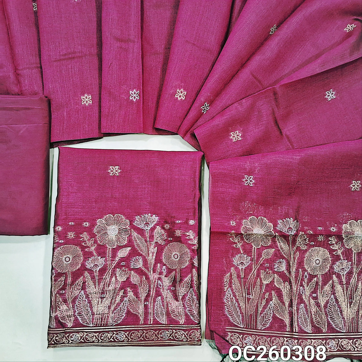 Rani pink premium silk cotton unstitched salwar material, buttas on front,antic gold and silver zari on daman,(lining needed)silky bottom,buttas on full length silk cotton dupatta with rich pallu. OC260308