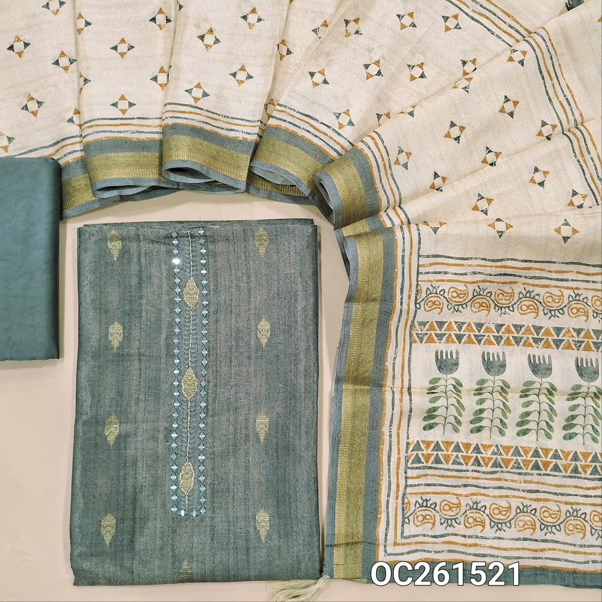 Grey with golden tint tissue silk cotton unstitched salwar material, real mirror yoke, copper zari buttas all over,(lining needed)silky bottom, digital printed soft tissue silk cotton dupatta with zari borders. OC261521