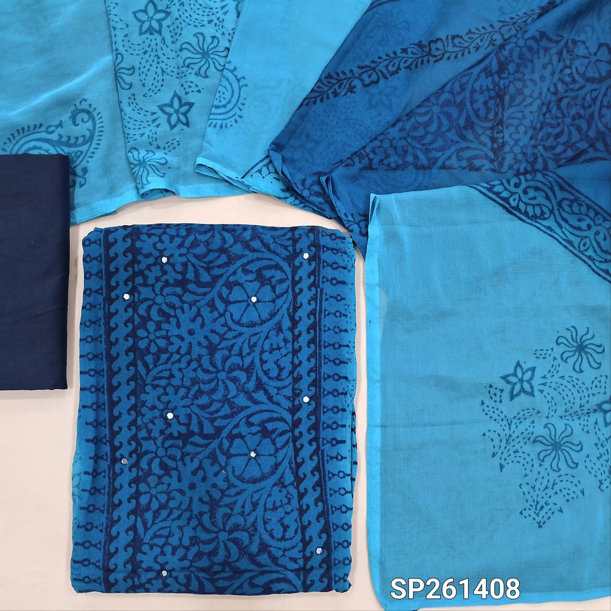 Light and Dark Blue handblock printed dual shaded semi georgette unstitched salwar material, faux mirror work on front (Thin, Lining Needed)matching silk cotton bottom, dual shaded fancy chiffon dupatta. SP261408