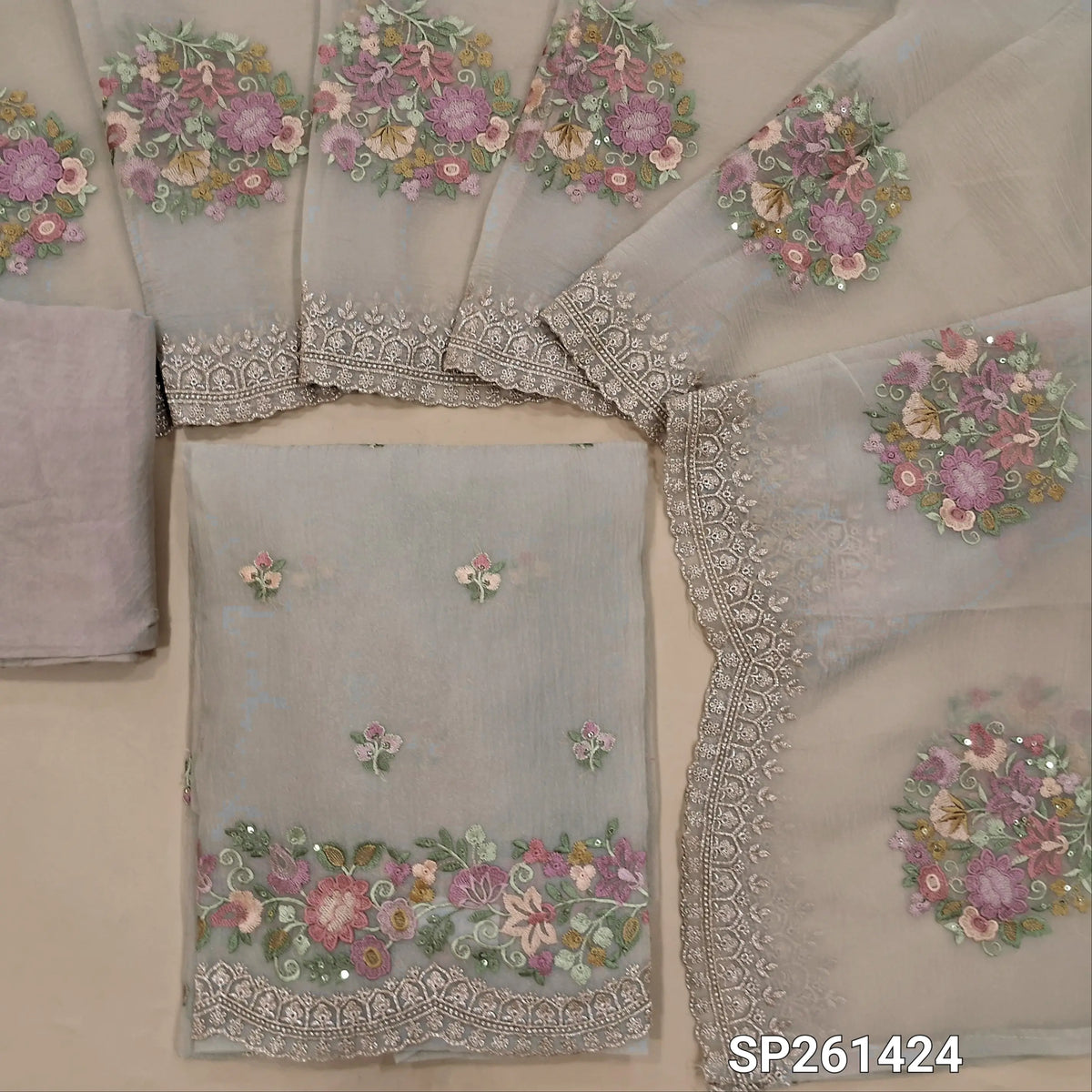 Designer light greyish beige pure crinkled organza unstitched salwar material, rich embroidery on front and daman (Thin, Lining Needed)matching silky bottom, crinkled organza dupatta with rich embroidery and scallop edges.  SP261424