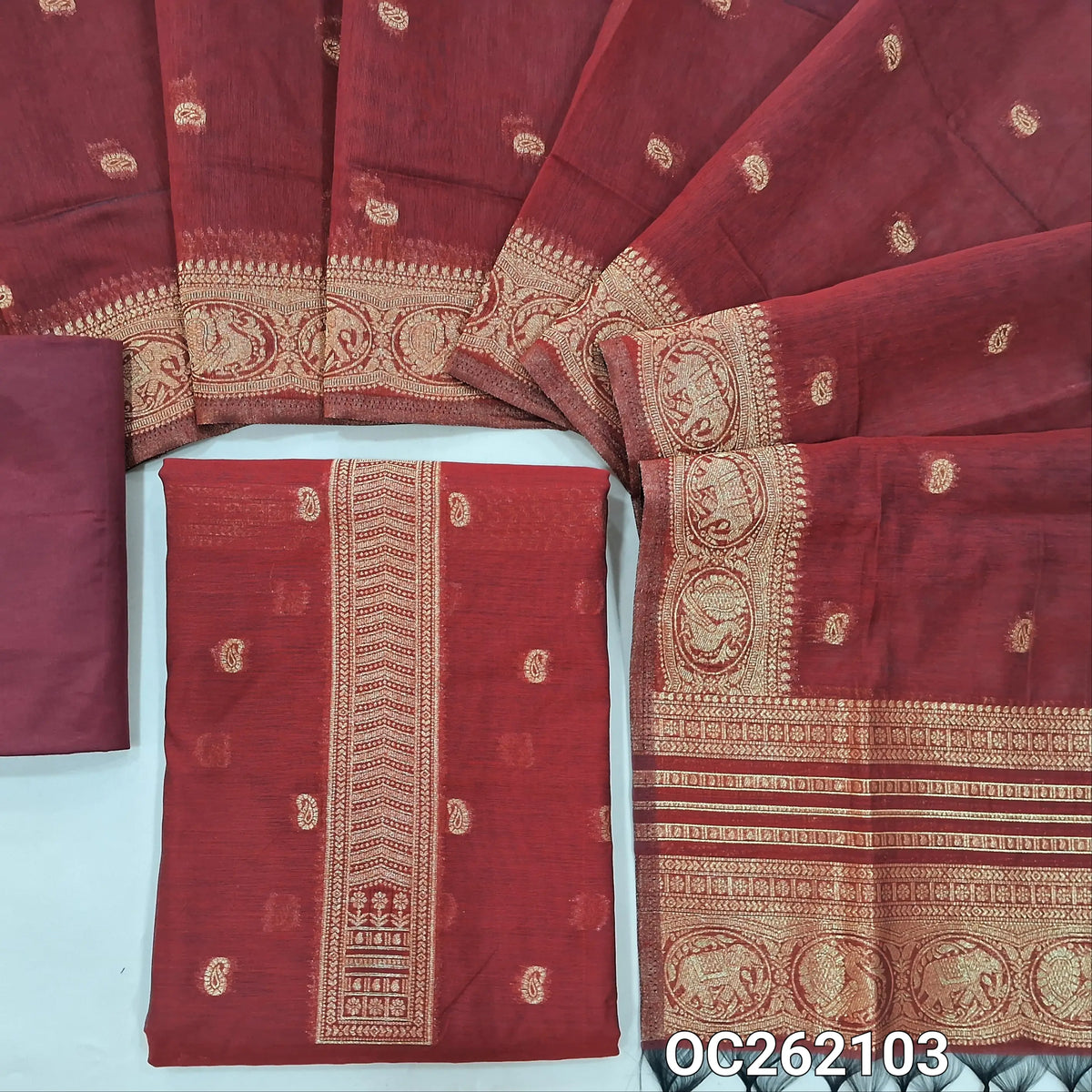 Dark maroon benarasi zari woven silk cotton unstitched salwar material, zari buttas all over,weaving on yoke, rich daman, (Lining Needed) silky bottom,zari buttas silk cotton dupatta with rich pallu and borders. OC262103