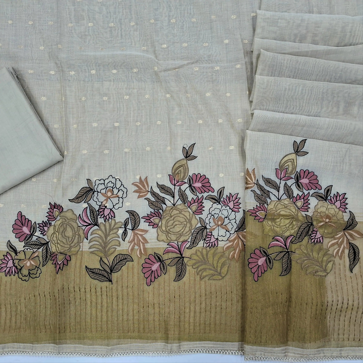 Rich beige premium silk cotton unstitched salwar material, zari buttas on front, applique work, thread embroidery and gold tissue daman,(lining needed)spun cotton bottom,silk cotton dupatta with applique and tissue pallu and lace tapping. SP261812