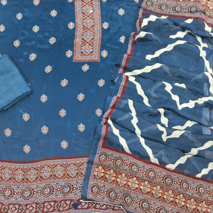 Indigo blue crepe silk unstitched salwar material, printed yoke with real mirror work, printed daman,(soft, shiny, lining needed)santoon bottom, printed short width chinon silk dupatta. SP261902