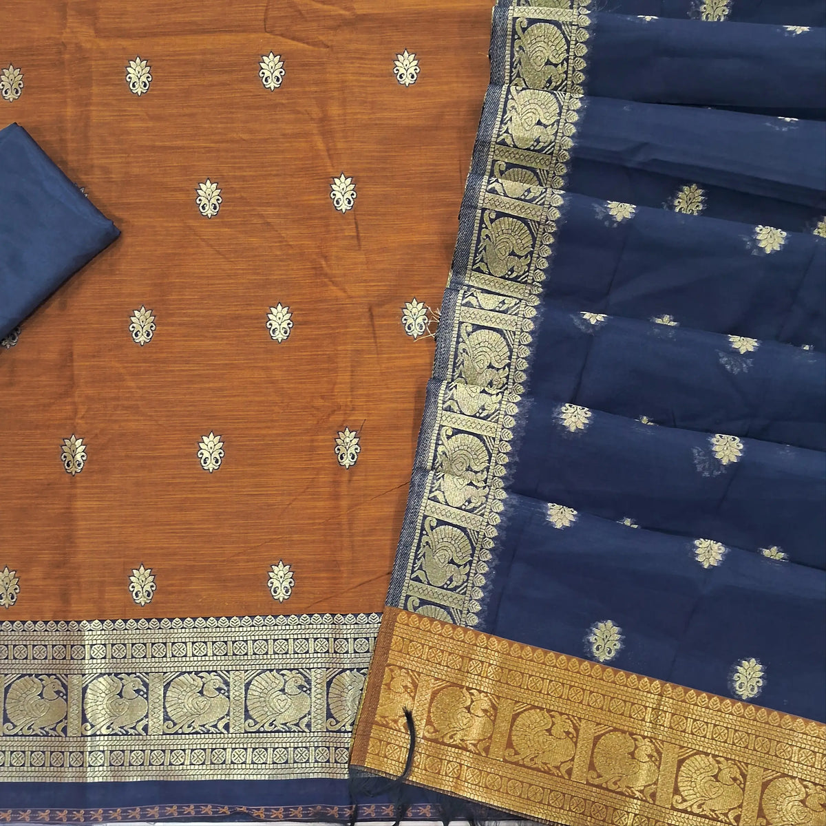 Honey brown premium silk cotton unstitched salwar material,buttas all over benarasi zari weaving daman, (lining needed)dark blue silky bottom,buttas on silk cotton dupatta with pallu and borders. SP261807