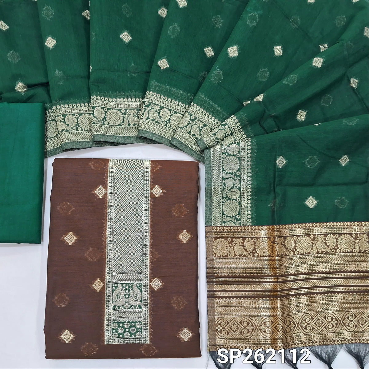 Dark brown silk cotton unstitched salwar material,benarasi zari weaving on front, rich weaving daman,(lining needed)teal green silky bottom, zari weaving on silk cotton dupatta with contrast pallu and zari borders. SP262112