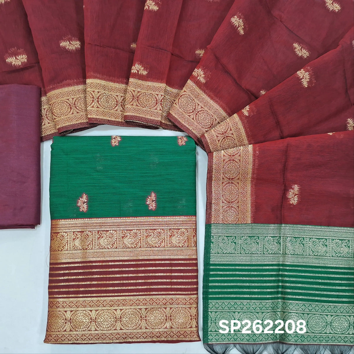 Bottle green premium silk cotton unstitched salwar material,buttas all over benarasi zari weaving daman, (lining needed)dark maroon silky bottom,buttas on silk cotton dupatta with contrast pallu and borders. SP262208