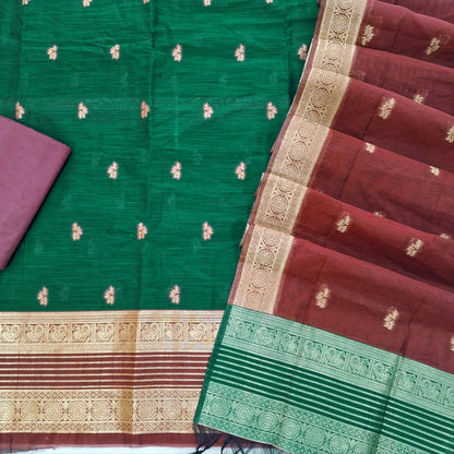 Bottle green premium silk cotton unstitched salwar material,buttas all over benarasi zari weaving daman, (lining needed)dark maroon silky bottom,buttas on silk cotton dupatta with contrast pallu and borders. SP262208