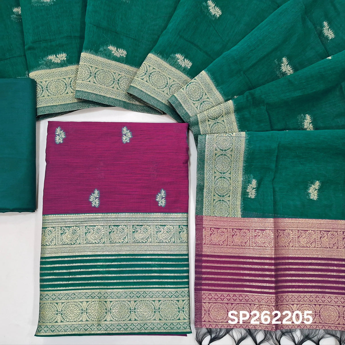 Rani pink premium silk cotton unstitched salwar material,buttas all over benarasi zari weaving daman, (lining needed)peacock green silky bottom,buttas on silk cotton dupatta with contrast pallu and borders. SP262205