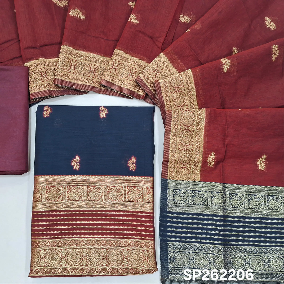 Dark blue premium silk cotton unstitched salwar material,buttas all over benarasi zari weaving daman, (lining needed)maroon silky bottom,buttas on silk cotton dupatta with contrast pallu and borders. SP262206