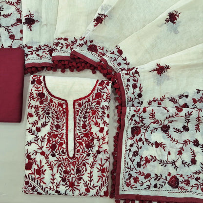Off white base silk cotton unstitched salwar material,heavy hand embroidery work on front,(EMBROIDERY PATTERN MIGHT VARY)(lining needed) dark maroon spun cotton bottom,silk cotton dupatta with rich pallu and borders with pom pom tapping. SP262119