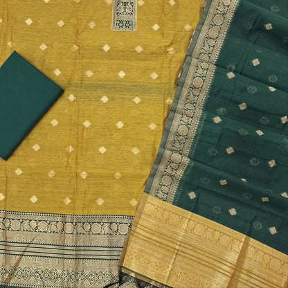 Light mehandhi green silk cotton unstitched salwar material,benarasi zari weaving on front, rich weaving daman,(lining needed)teal green silky bottom, zari weaving on silk cotton dupatta with contrast pallu and zari borders. SP262115