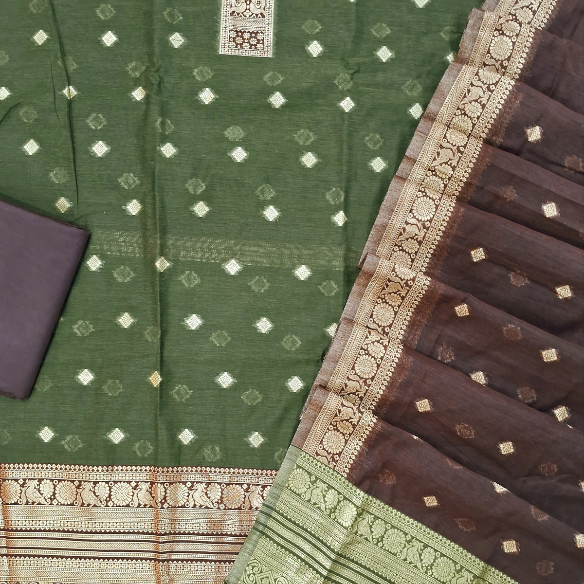 Olive green silk cotton unstitched salwar material,benarasi zari weaving on front, rich weaving daman,(lining needed)dark brown silky bottom, zari weaving on silk cotton dupatta with contrast pallu and zari borders. SP262114