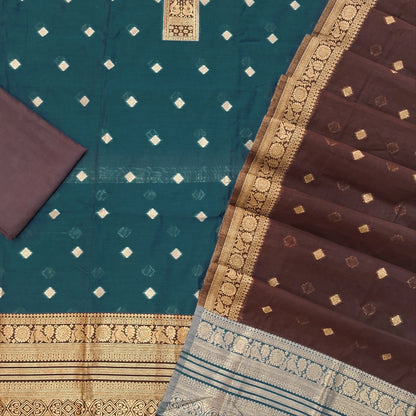 Teal blue silk cotton unstitched salwar material,benarasi zari weaving on front, rich weaving daman,(lining needed)dark brown silky bottom, zari weaving on silk cotton dupatta with contrast pallu and zari borders. SP262113