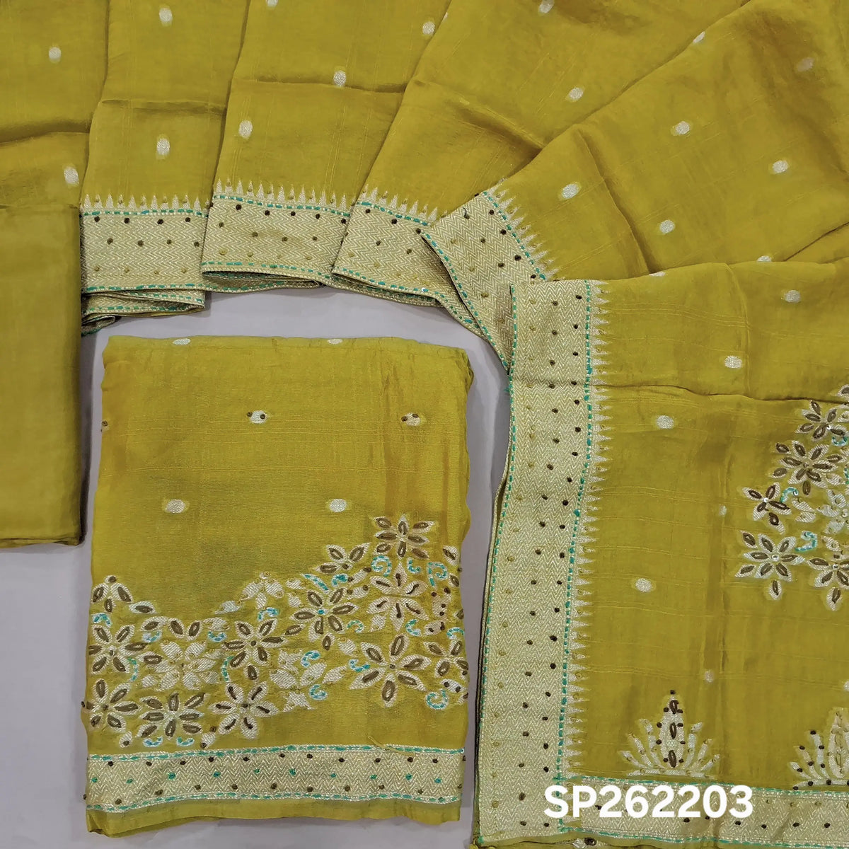 Mehandhi yellow jakard dola silk unstitched salwar material,self woven design& antic gold zari buttas, weaving with hand embroidery daman& yoke,(Lining Needed)silk bottom, jakard dola silk dupatta with rich weaving pallu and embroidery borders. SP262203
