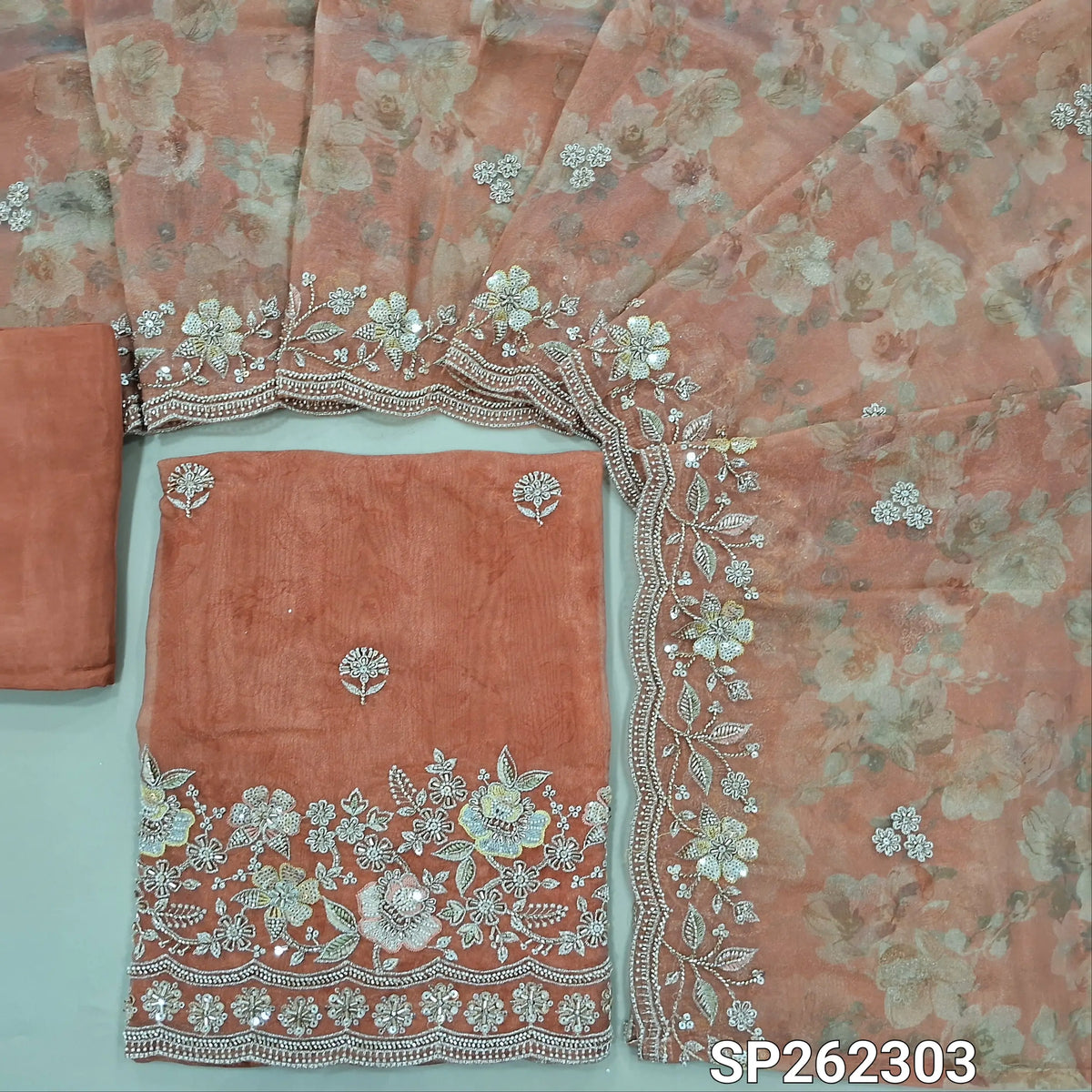 Peachish pink pure tissue organza silk digital printed unstitched salwar material, rich zardosi, cut bead ad sequins detailing on front and daman (Thin, Lining Needed)matching santoon bottom,dupatta with digital prints and rich bead detailing. SP262303