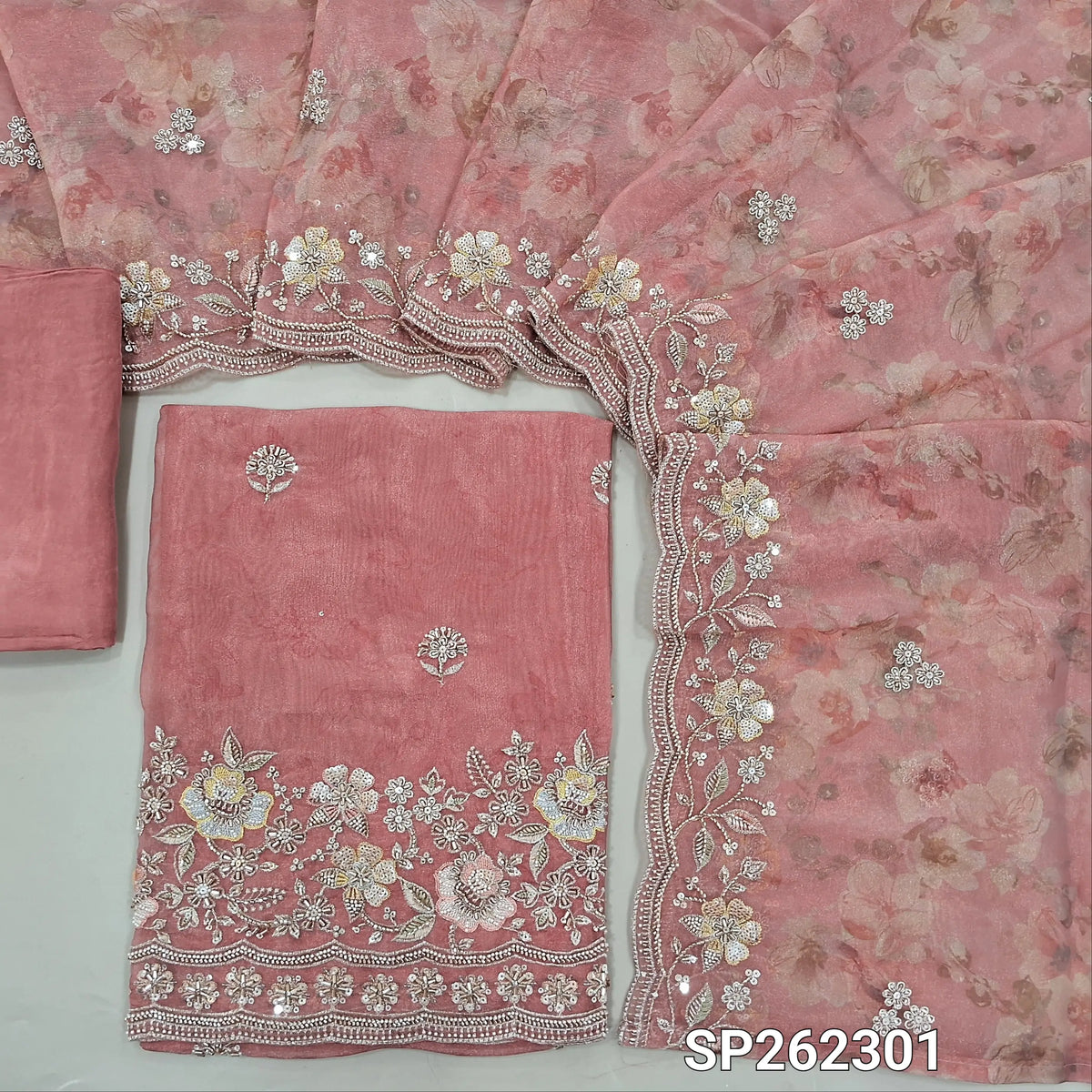 Pastel pink pure tissue organza silk digital printed unstitched salwar material, rich zardosi, cut bead ad sequins detailing on front and daman (Thin, Lining Needed)matching santoon bottom,dupatta with digital prints and rich bead detailing. SP262301