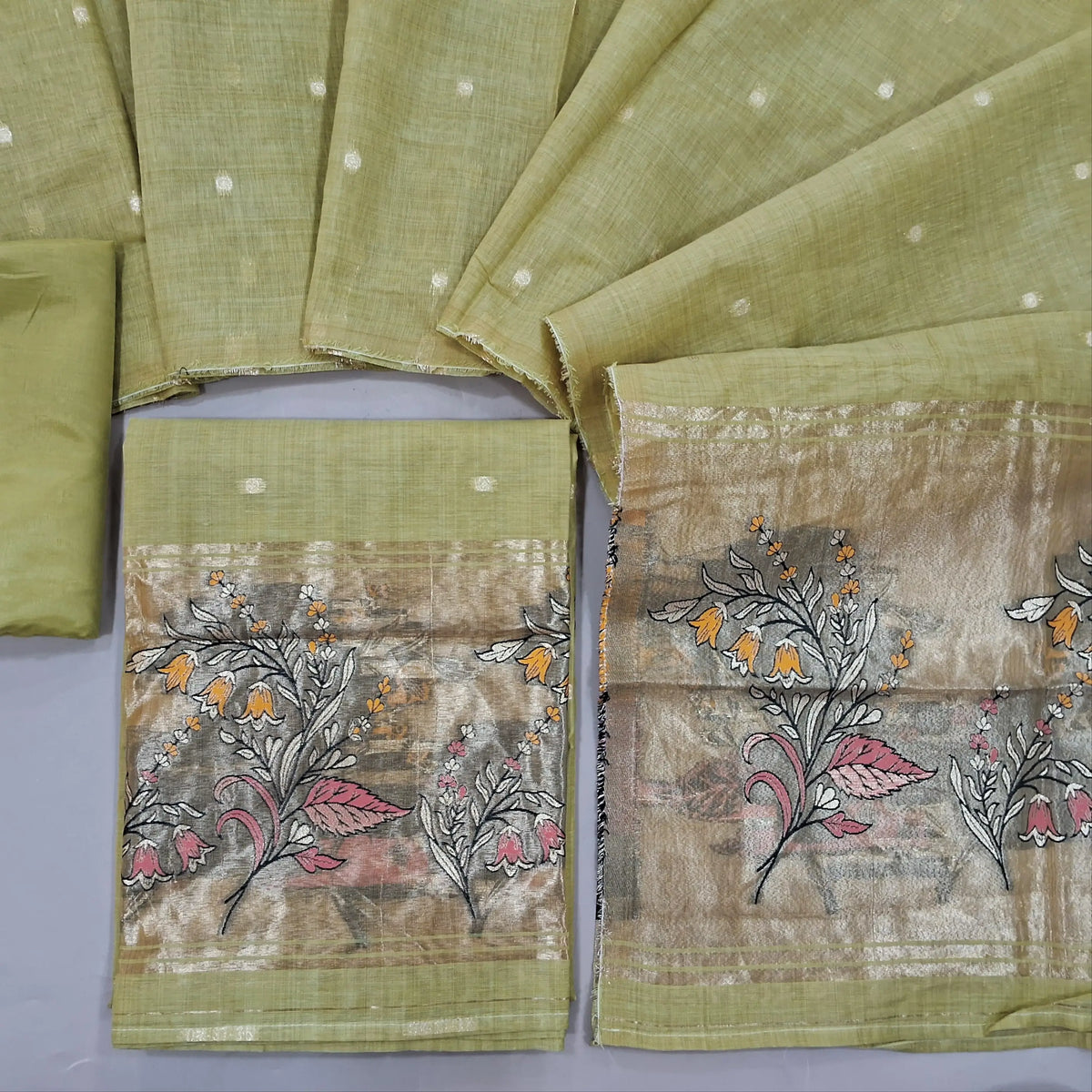 Light mehandhi green lightweight silk cotton unstitched salwar material, zari weaving all over. gold tissue daman(Thin, Lining Needed)matching silky bottom, silk cotton dupatta with tissue pallu. SP262319
