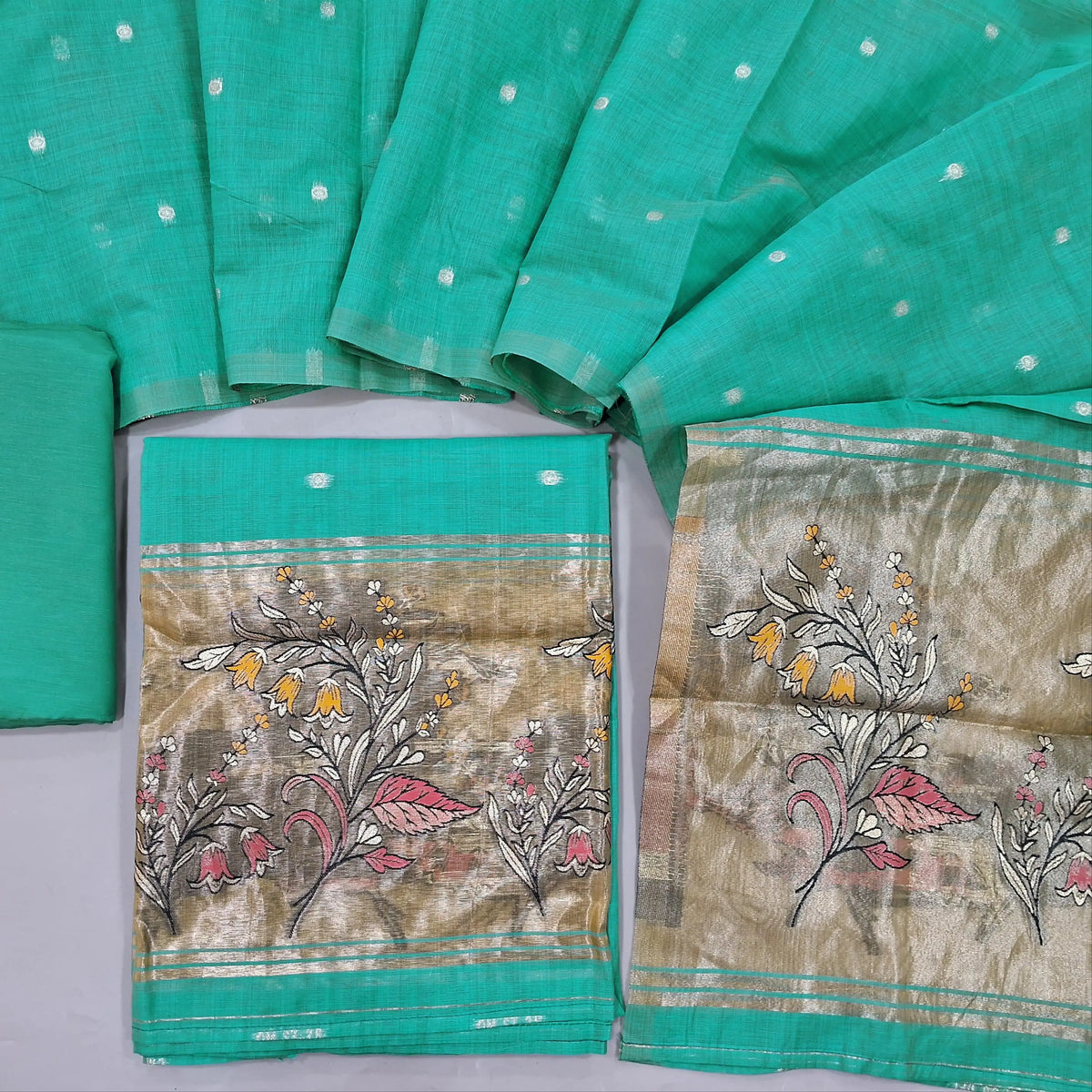 Pastel blue lightweight silk cotton unstitched salwar material, zari weaving all over. gold tissue daman(Thin, Lining Needed)matching silky bottom, silk cotton dupatta with tissue pallu. SP262316