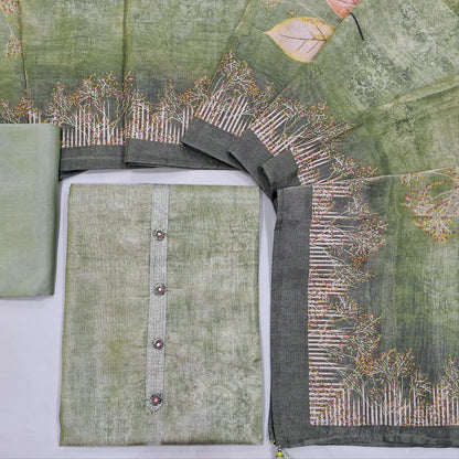 Cardamom green with golden tint printed tissue silk cotton unstitched salwar material, fancy buttons on yoke(thin fabric, lining needed)matching santoon bottom, printed tissue silk cotton full length dupatta. CODE NV242024