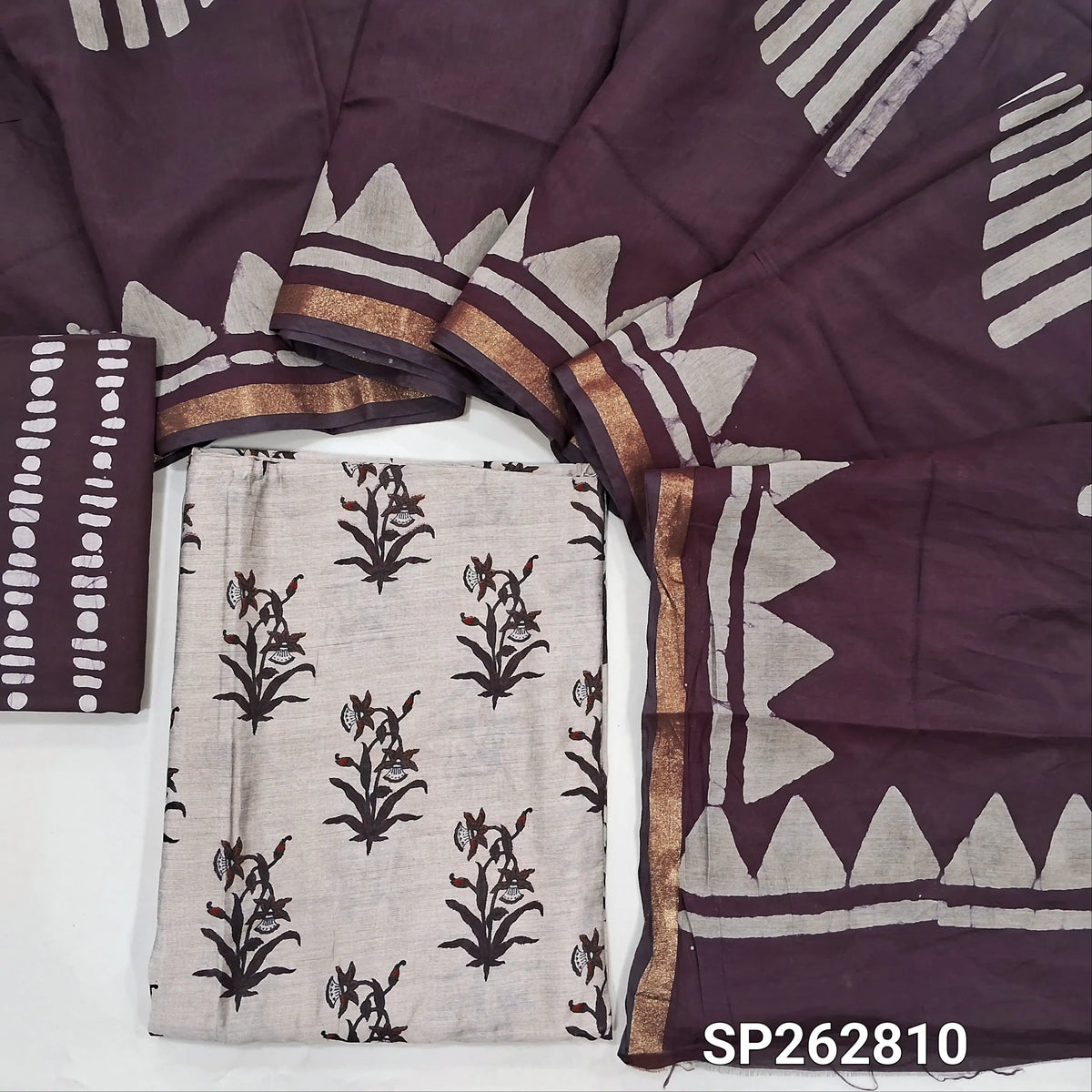 Greyish beige base printed silk cotton unstitched salwar material,(lining needed)dark maroon batik dyed cotton bottom,batik dyed silk cotton dupatta(TAPPING NEEDED). SP262810