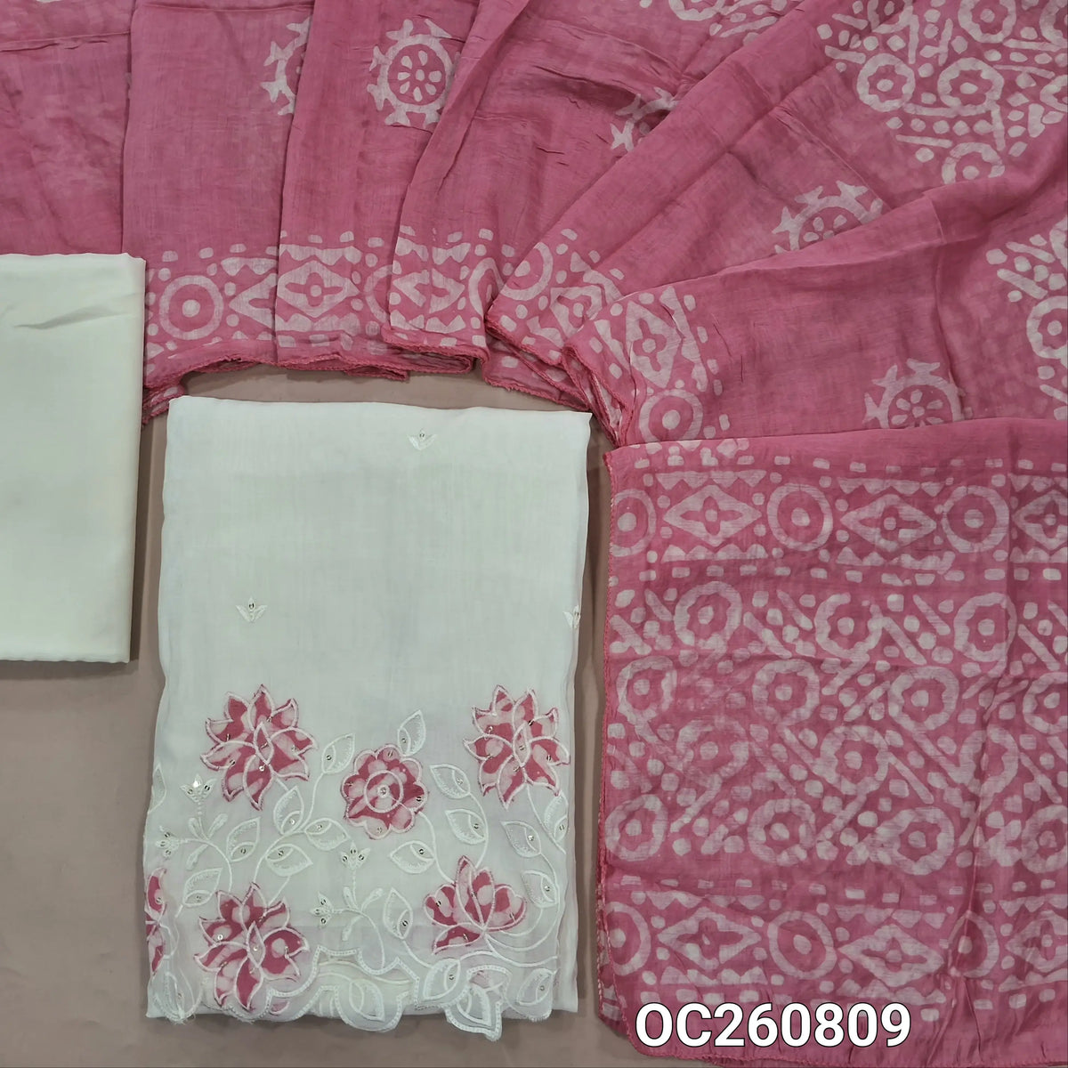 Off white base mul chanderi unstitched salwar material, embroidery on front, applique & embroidery with cutwork daman, (Lining Needed) silky bottom, (PINK)batik design on soft silk cotton dupatta. OC260809