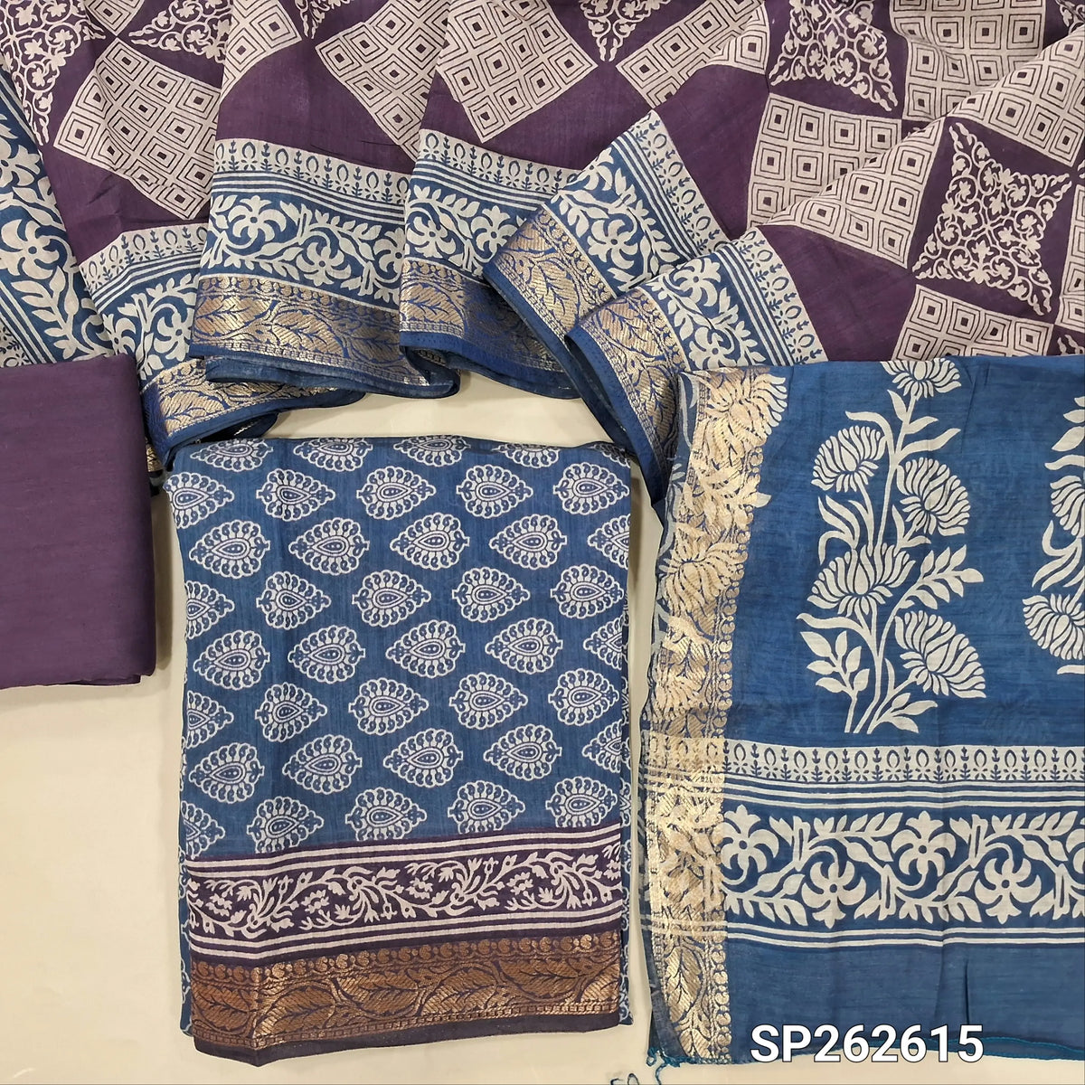Blue printed silk cotton unstitched salwar material,contrast borders with zari weaving (lining needed)purple cotton bottom,dual shaded printed full length silk cotton dupatta with zari woven borders. SP262615