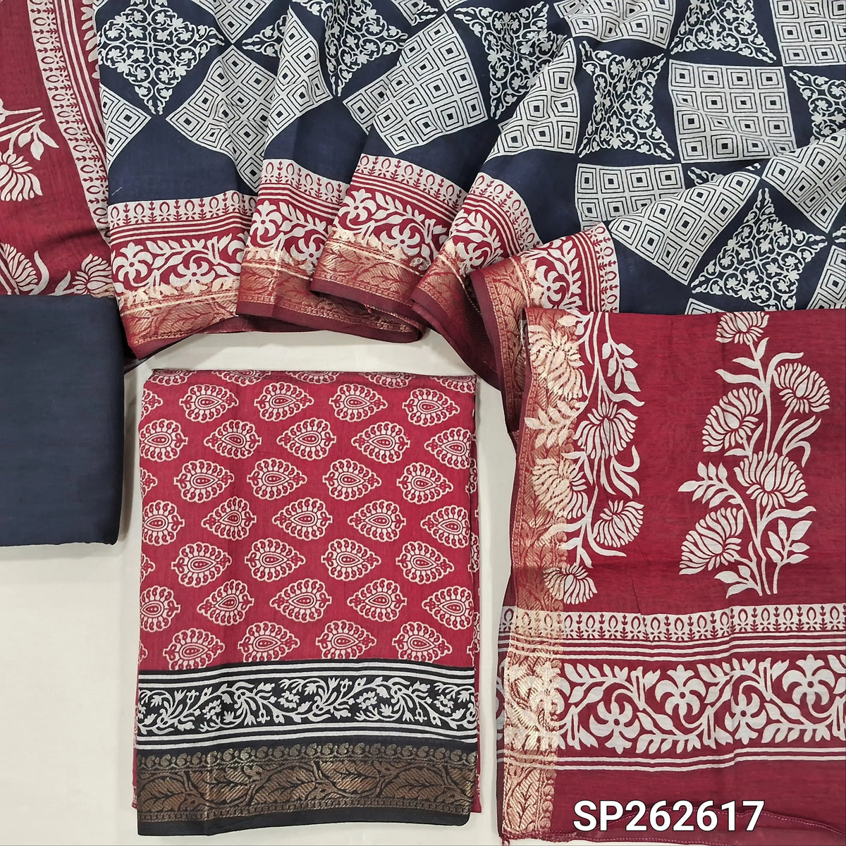 Maroon printed silk cotton unstitched salwar material,contrast borders with zari weaving (lining needed)dark blue cotton bottom,dual shaded printed full length silk cotton dupatta with zari woven borders. SP262617