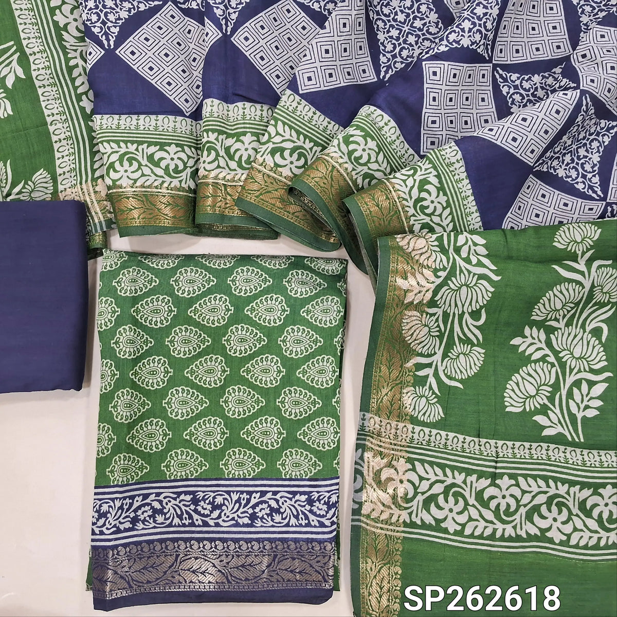 Leafy green printed silk cotton unstitched salwar material,contrast borders with zari weaving (lining needed)blue cotton bottom,dual shaded printed full length silk cotton dupatta with zari woven borders. SP262618