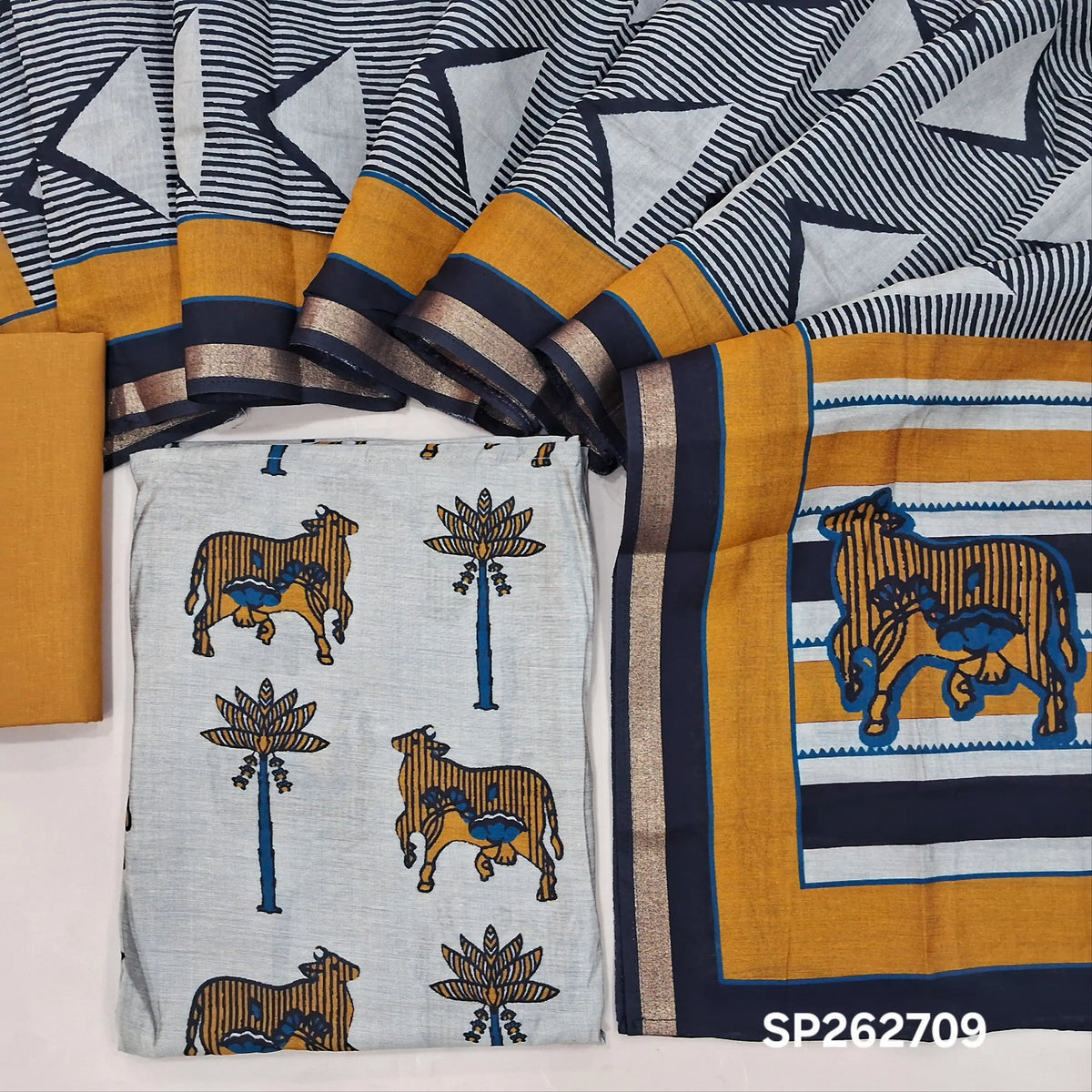 Grey silk cotton unstitched salwar material,pichwai printed all over,(lining needed)mehandhi yellow cotton bottom,printed full length silk cotton dupatta with pallu & zari borders. SP262709