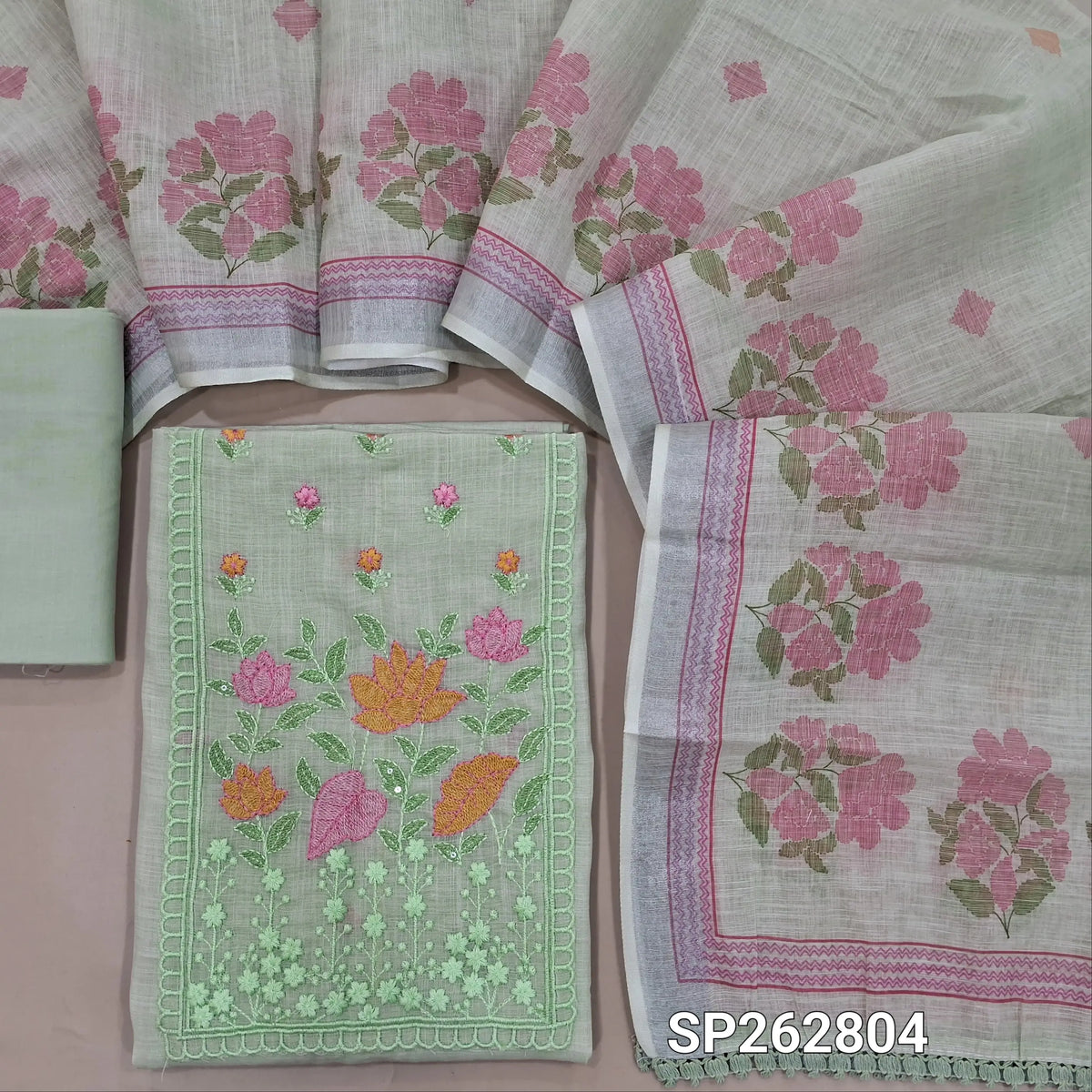 Pastel green premium semi linen unstitched salwar material,thread embroidery work on yoke, floral printed on daman(lining needed) cotton bottom,floral printed premium semi linen dupatta with silver tissue borders. SP262804