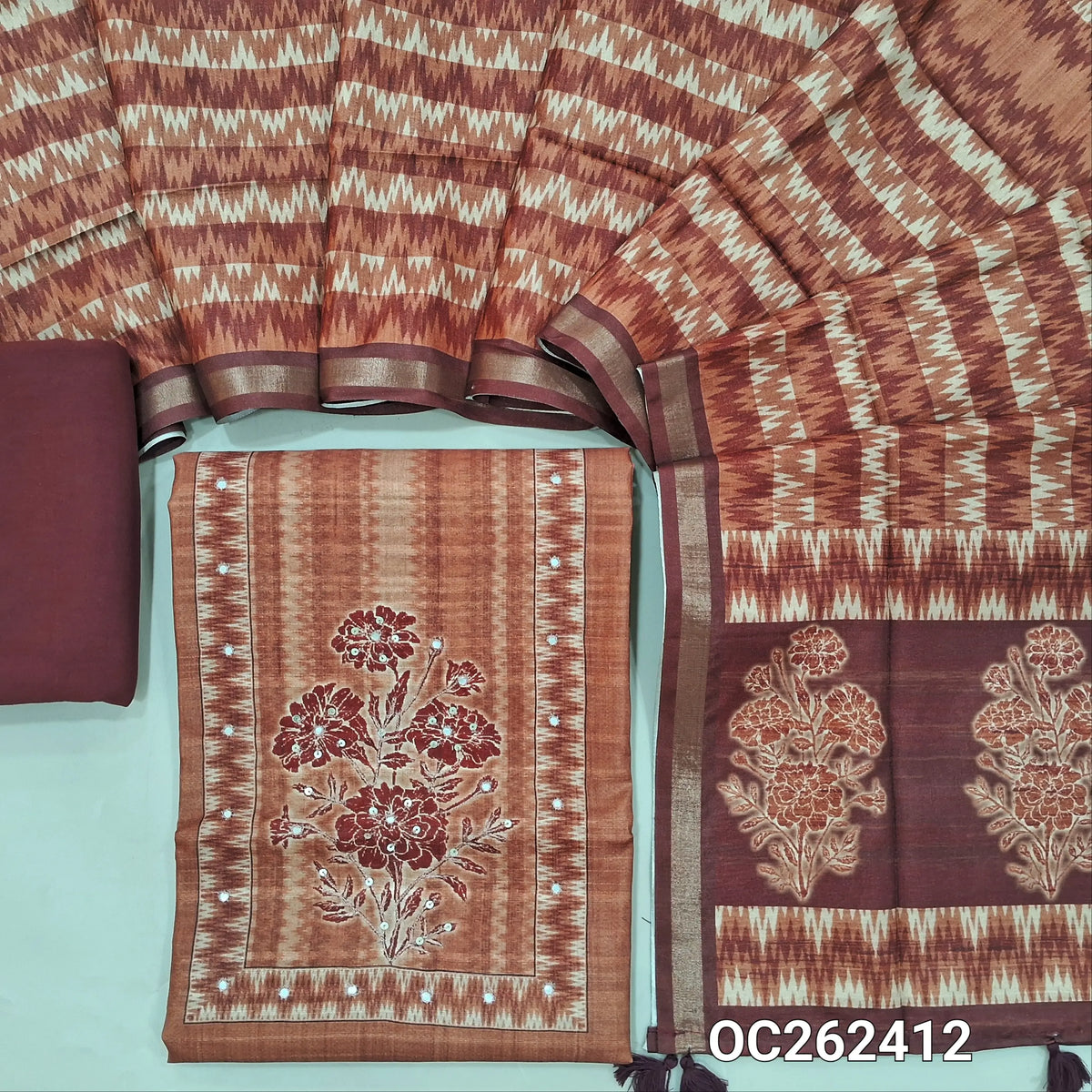 Brown semi gicha unstitched salwar material, floral design with faux miror and thread work on yoke,(thin fabric, lining needed)spun cotton bottom, digital printed semi gicha dupatta with tissue borders. OC262412
