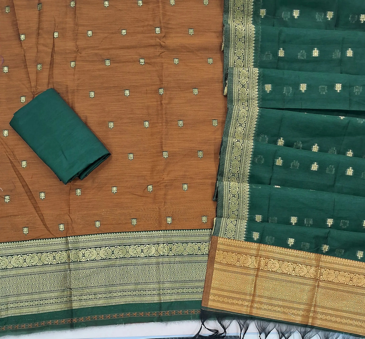 Honey brown premium silk cotton unstitched salwar material,buttas all over benarasi zari weaving daman, (lining needed)bottle green  silky bottom,buttas on dual shaded silk cotton dupatta with rich pallu and borders. SP262917