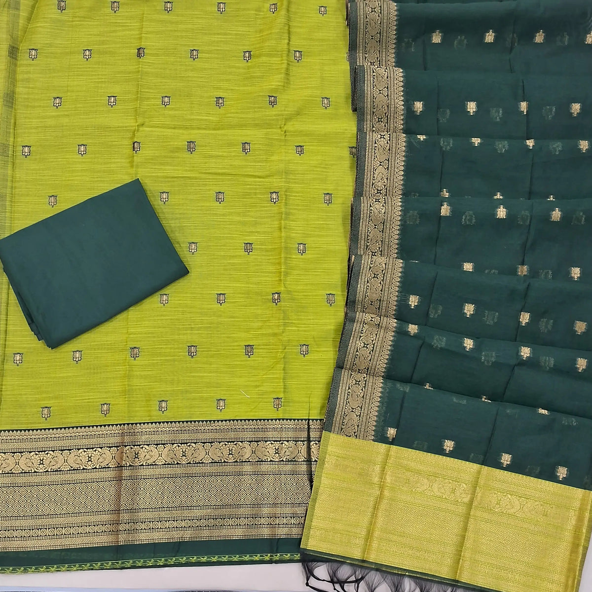 Light green premium silk cotton unstitched salwar material,buttas all over benarasi zari weaving daman, (lining needed)bottle green  silky bottom,buttas on dual shaded silk cotton dupatta with rich pallu and borders. SP262914